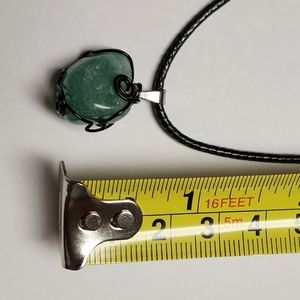 Handmade wire wrap stone pendant with cord.